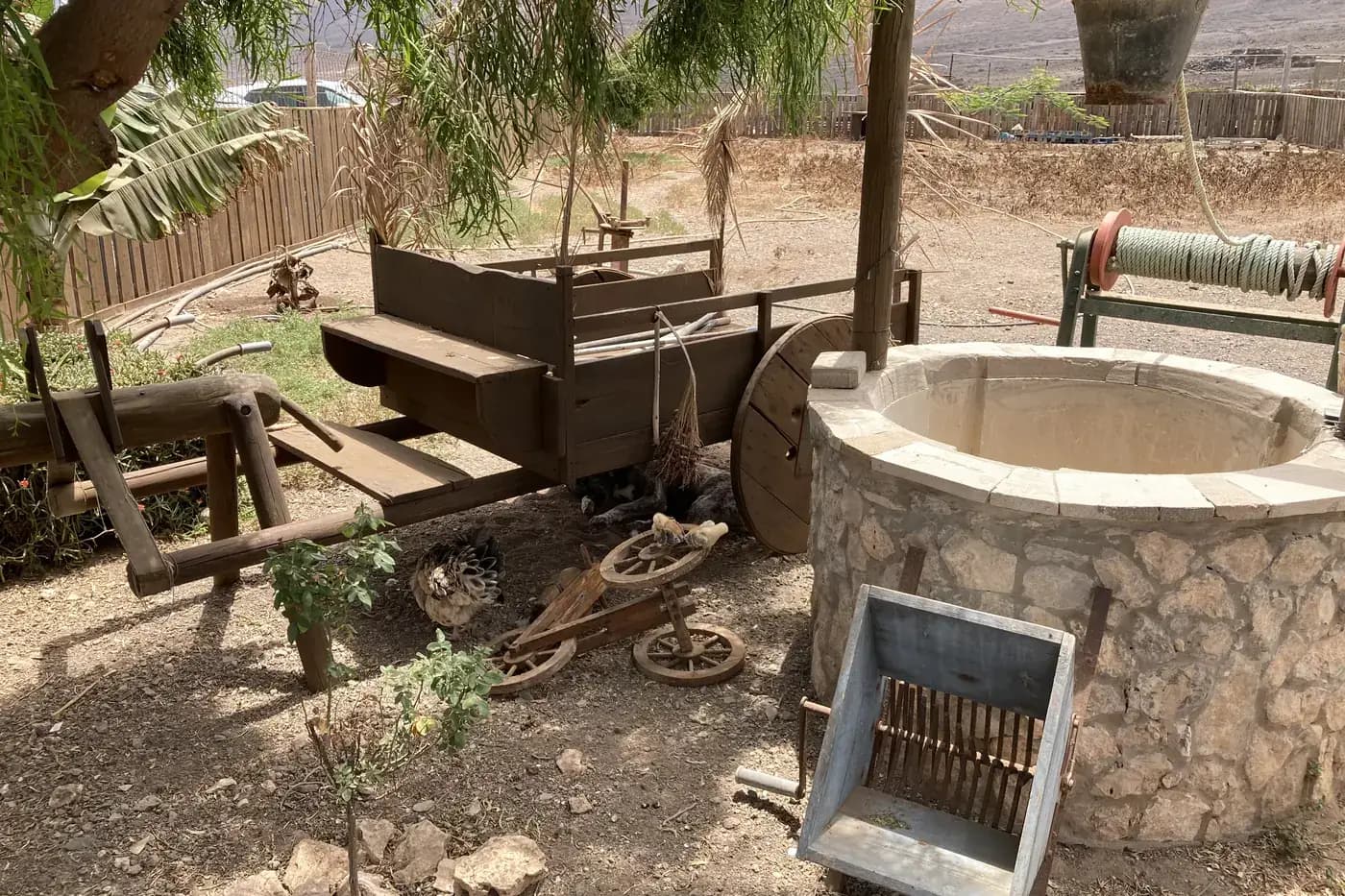 Old wooden cart next to a well, in the hamlet of Cofete