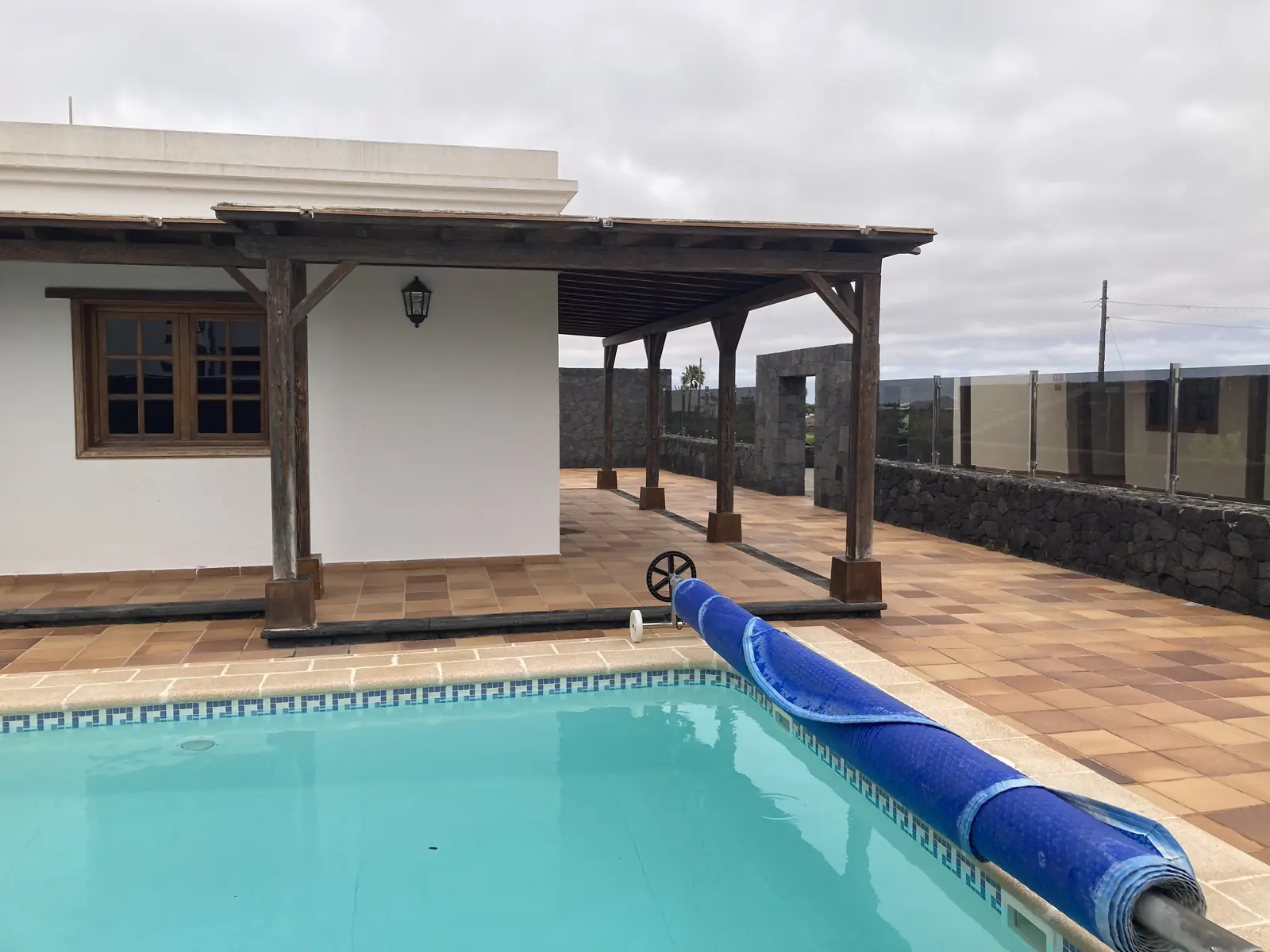 Pool and pergola of the private-pool villa booked on Booking.com near Arrecife, Lanzarote