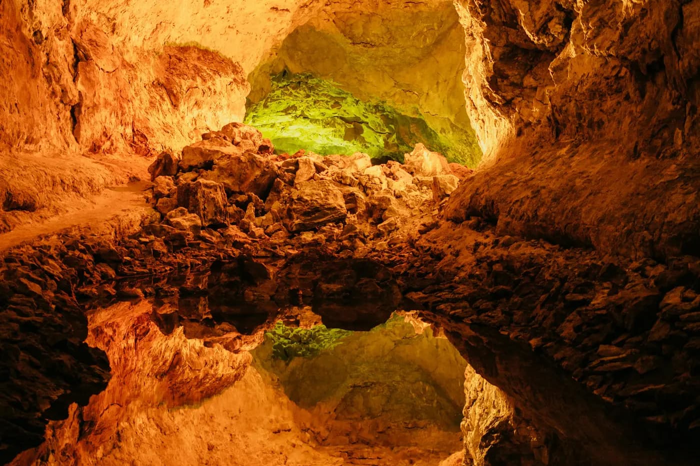 Illuminated gallery of Cueva de los Verdes with its play of colours