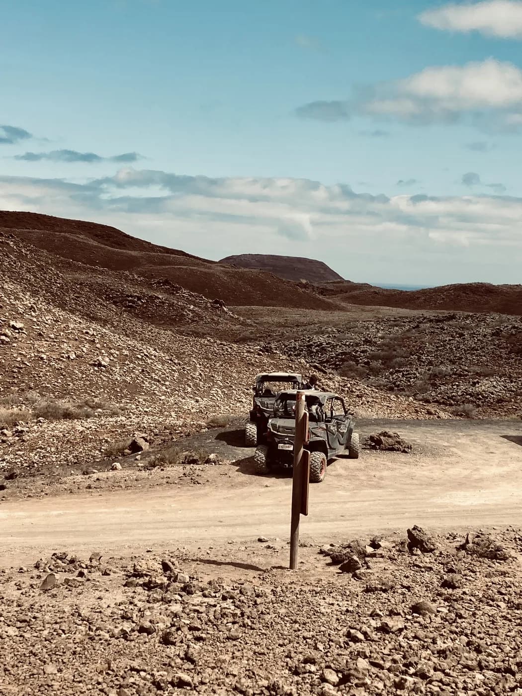 A buggy stopped on a volcanic track in Fuerteventura's interior