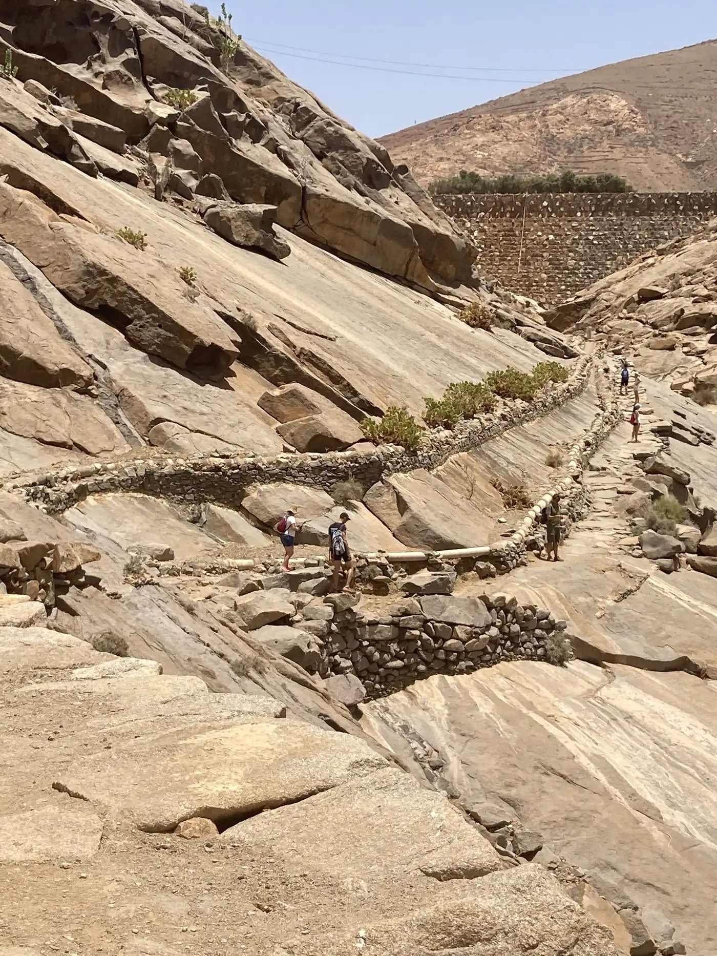 A steep trail cut into the cliff, in the mountains of inland Fuerteventura