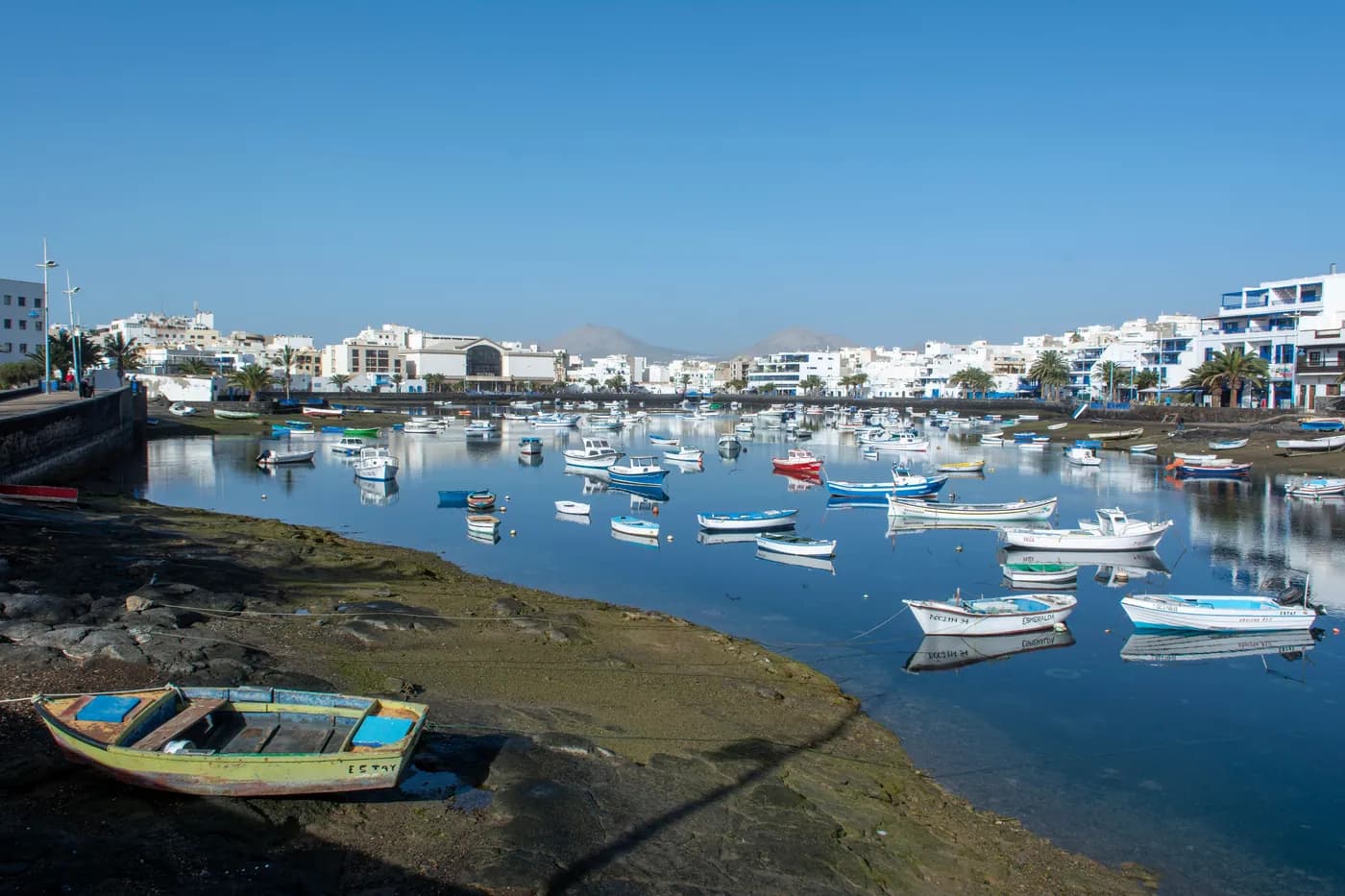 Colourful fishing boats floating on the Charco de San Ginés lagoon in Arrecife